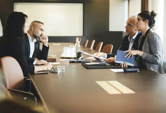 Lawyers in office with some official documents on a table